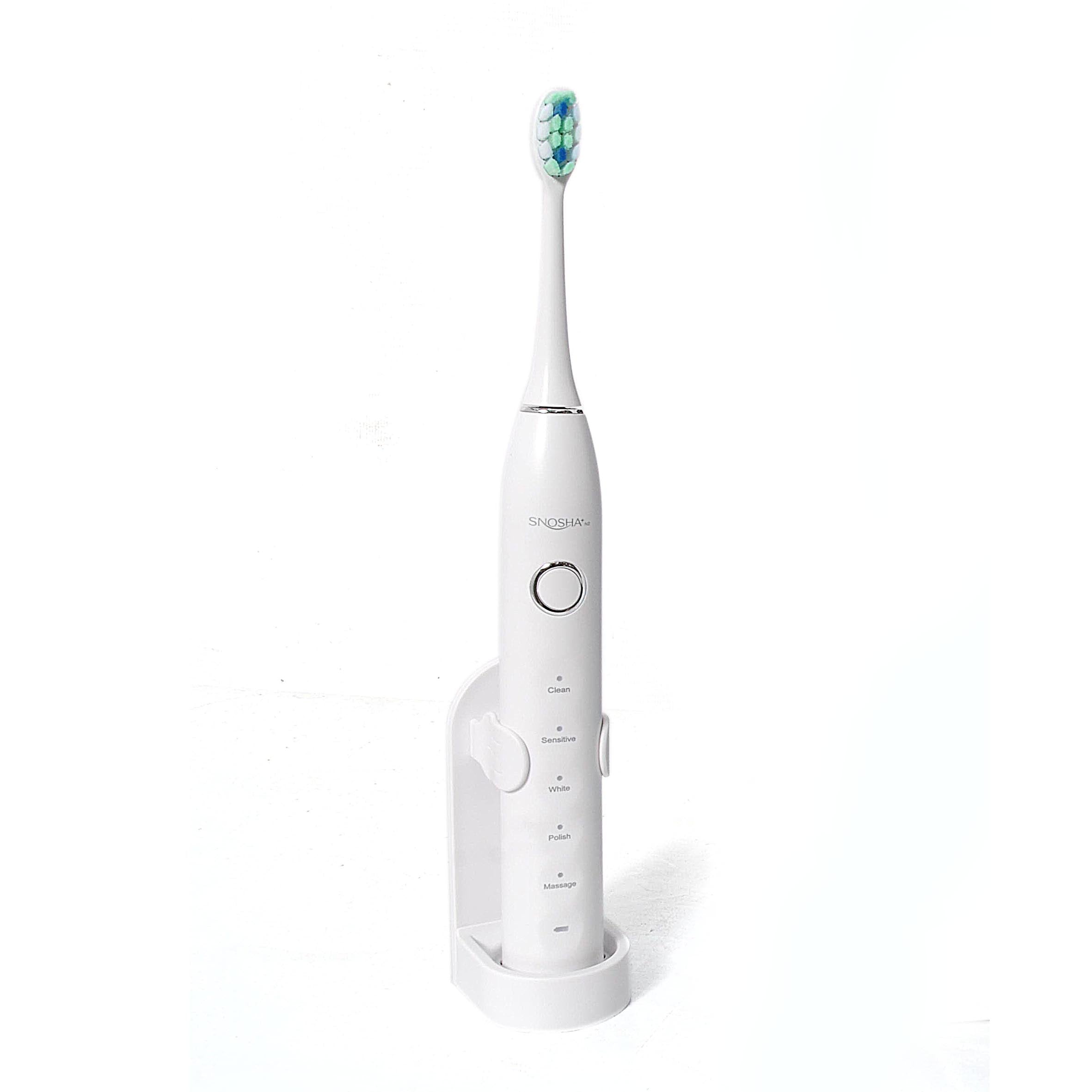 Snosha N2 white sonic electric toothbrush in charging stand on white background