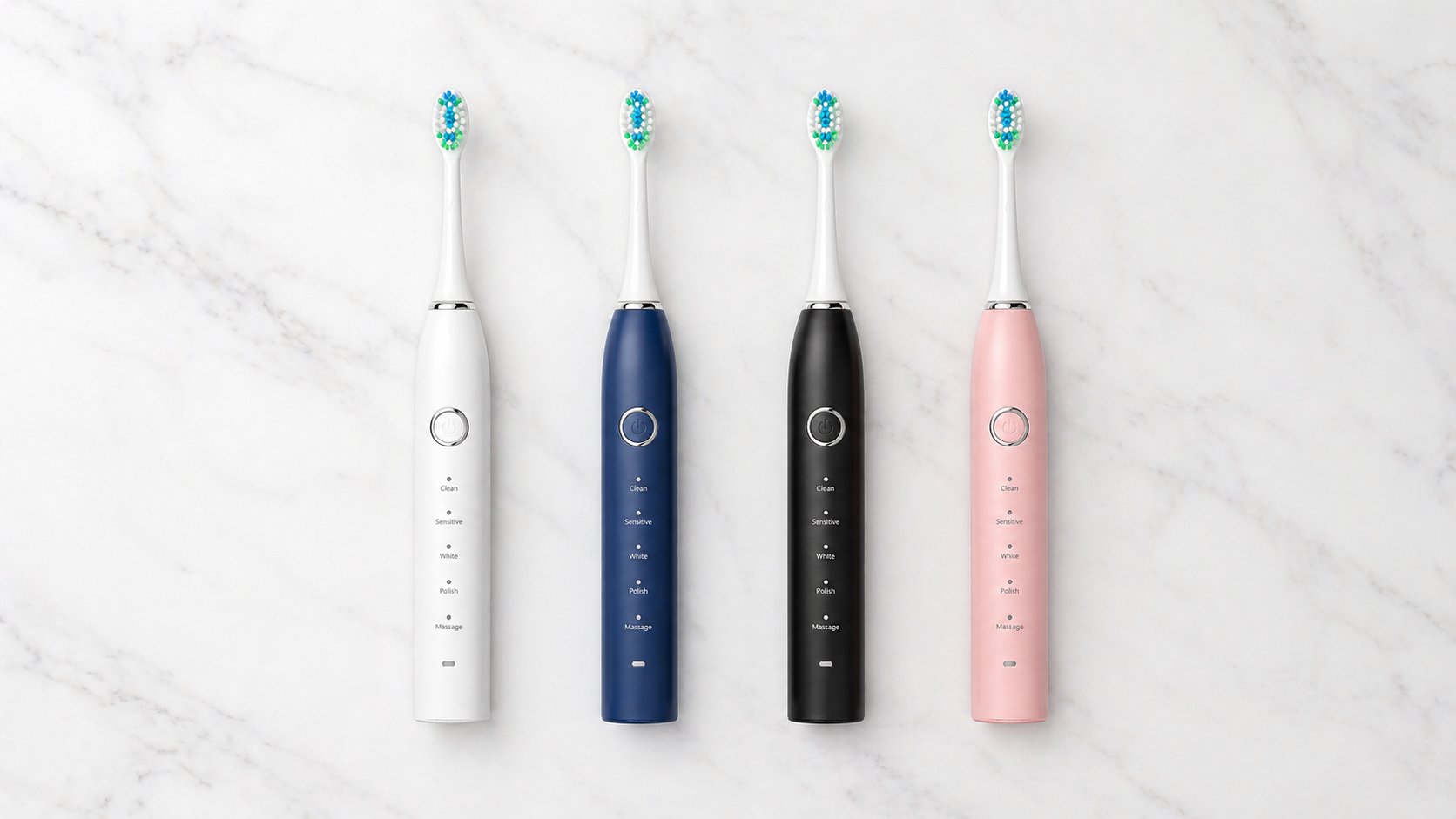 Snosha N2 electric toothbrush all four colors  white, blue, black, and pink  lined up on marble surface