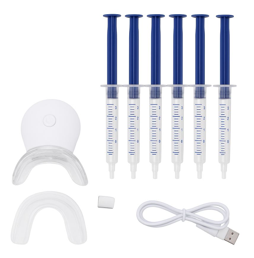 Snosha teeth whitening kit with mouthpiece and gel syringes on blue bathroom surface