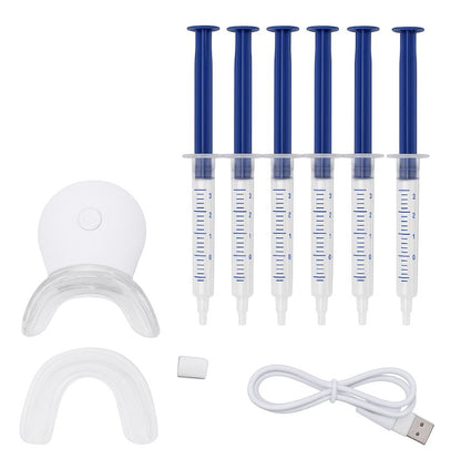 Snosha teeth whitening kit with mouthpiece and gel syringes on blue bathroom surface